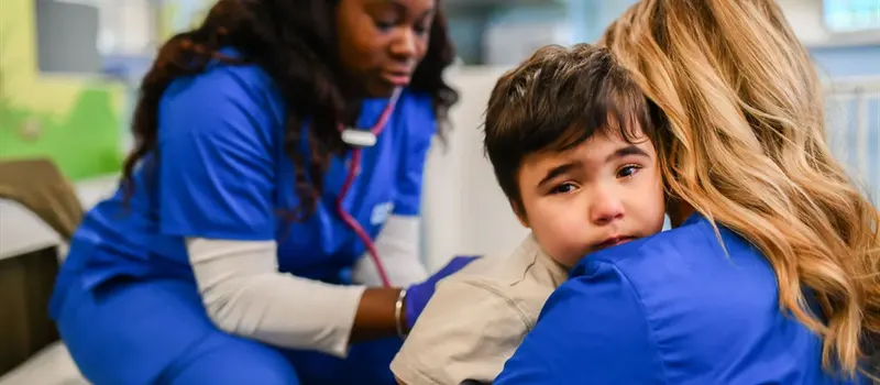 How To Start A Daycare | Preschool Business Guide 2026 5 A Preschool Daycare Medical Attendant Is Comforting A Child With A Hug