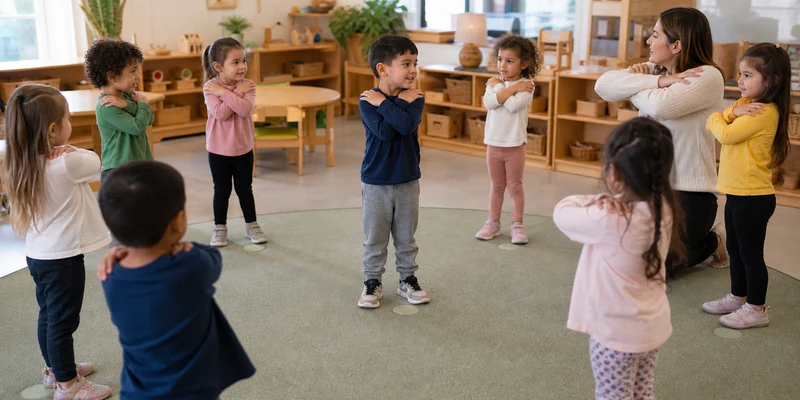 18 Circle Time Activities That Keep Preschoolers Engaged 2 Preschool Children Copying A Classmate'S Simple Movement During Circle Time